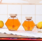 Custom SGS Glass Storage Bottles Hexagon Honey Jars 0.5L To 1L Wooden Lid